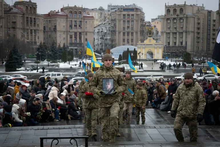 Photo of a United Nations Security Council meeting discussing the Russia-Ukraine conflict, with representatives engaged in serious deliberation.